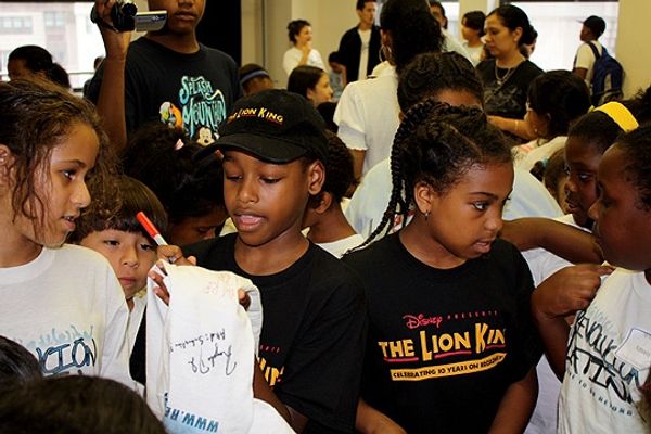 Jeremy Gumbs and Cypress Eden Smith meet the kids and sign autographs Photo
