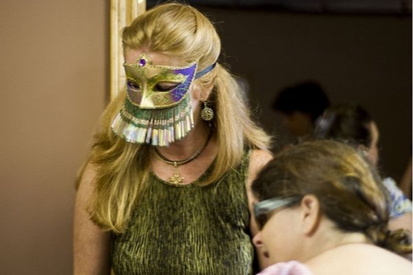 KVPAC Board President, Patti Lacy, displays an elaborate mask for sale at the KVPAC G Photo