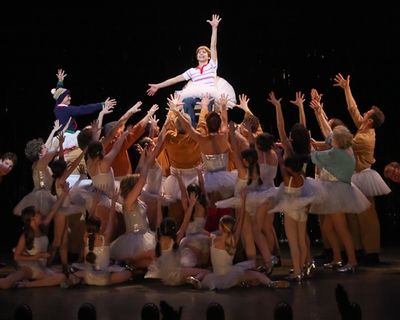 Kiril Kulish is lifted by the cast Photo