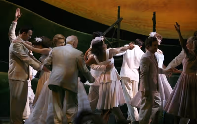 Cheyenne Jackson, Jim Norton, Kate Baldwin and the cast dance at the curtain call Photo
