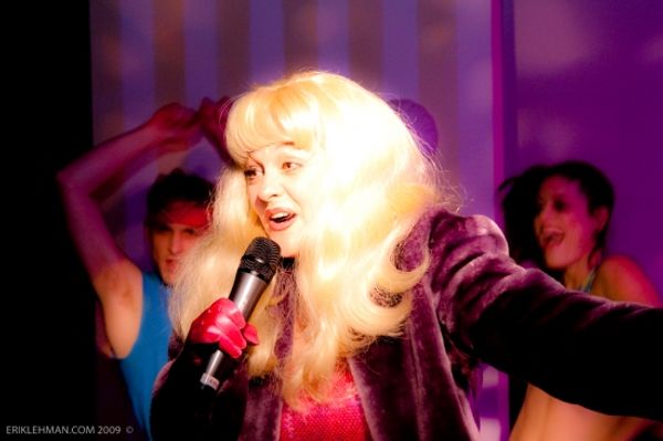 Julie Brown performing her song 'Cause I'm a Blonde' with the Varsity Interpretative  Photo