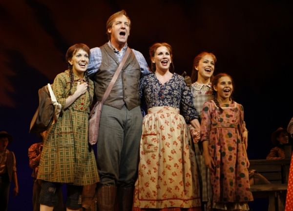 The Ingalls family Kara Lindsay as Laura Ingalls, Steve Blanchard as Charles (Pa) Ing Photo