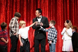 Lance Burton and children from the audience Photo