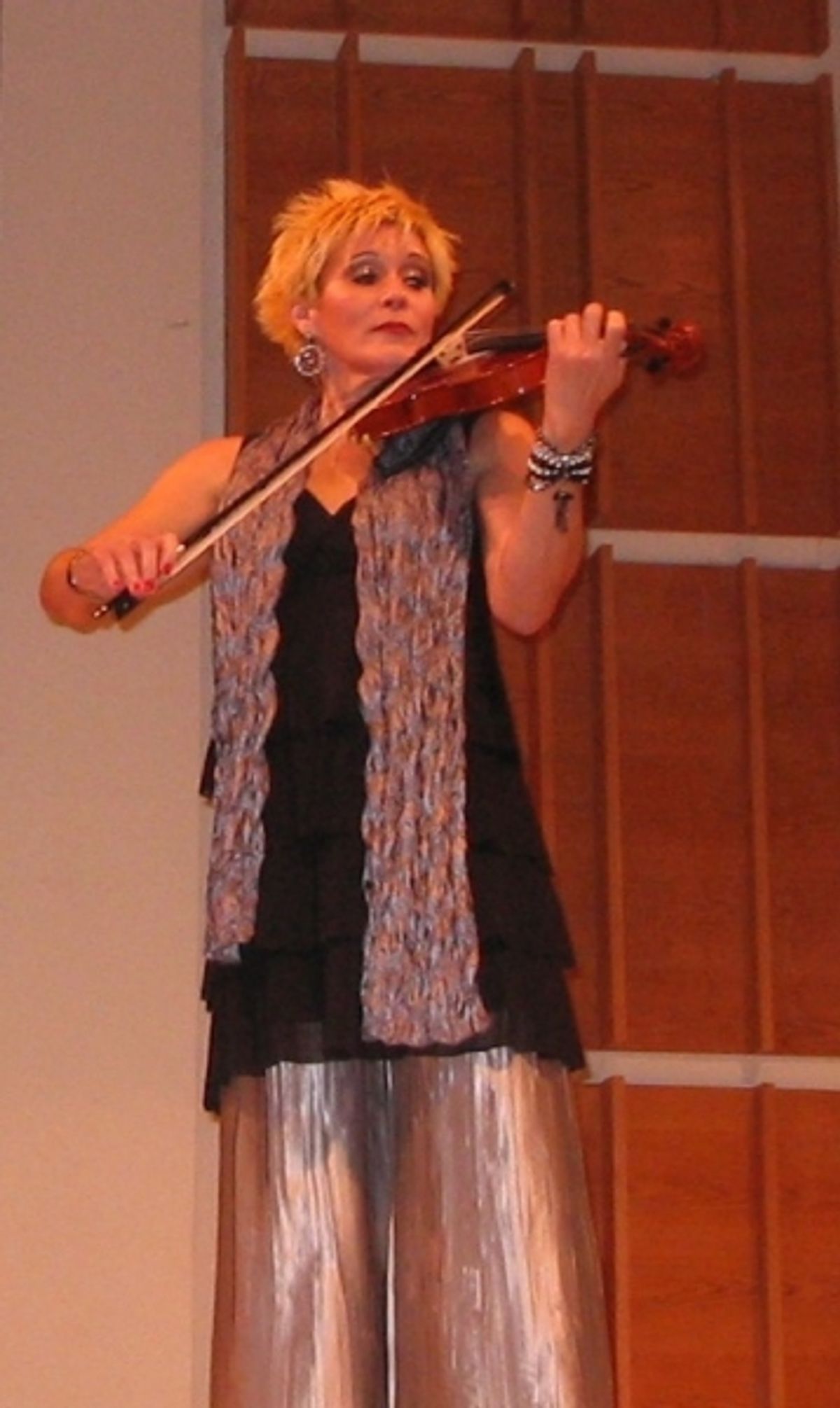 Sylvia McNair plays the violin at 