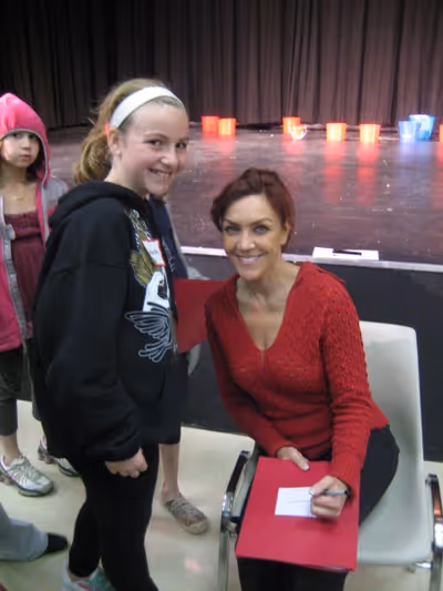 Andrea McArdle signs autographs for students Photo