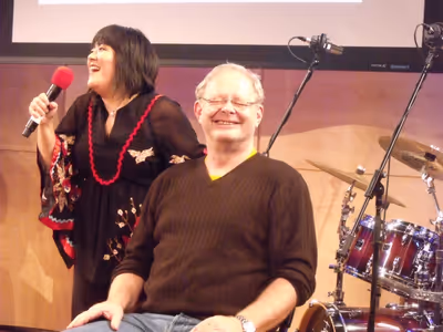 Ann Harada with and audience member Brian Kaltner lip-synching to Norm LewisÃ¢â‚ Photo