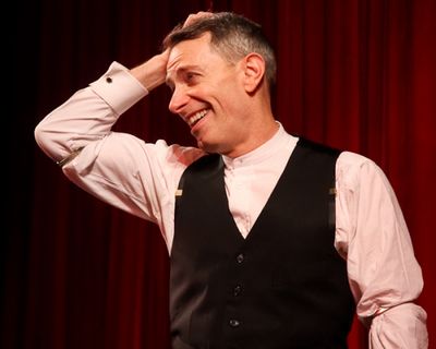 Arnie Burton, the production's remaining original cast member, speaks to the crowd Photo
