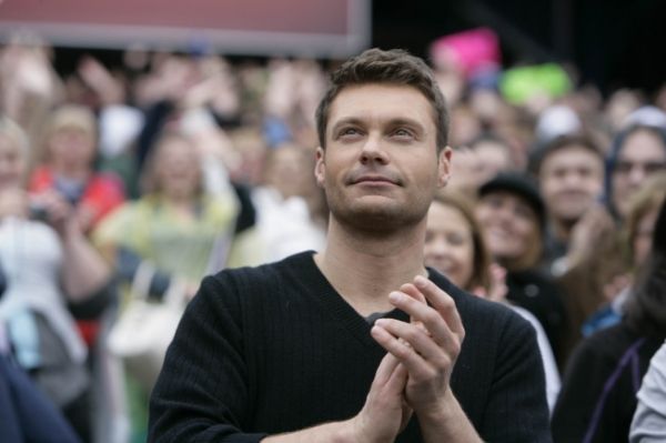 Ryan Seacrest welcomes Boston auditioners as they arrive for their chance to become t Photo