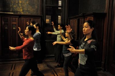 Women practice a tango move. Left: Alexandria Wailes, Ana Grosse and Itsuko Higashi R Photo