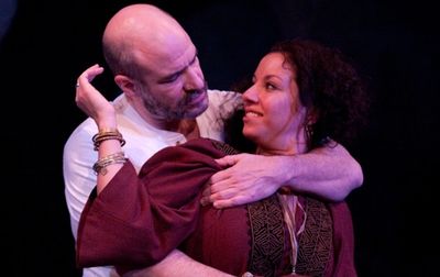 Yusef (Demosthenes Chrysan) and his wife Ambara (Suehyla El-Attar) share a moment tog Photo