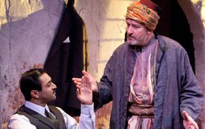 The enterprising young nephew Tariq (Bhavesh Patel) discusses the crisis in Palestine Photo