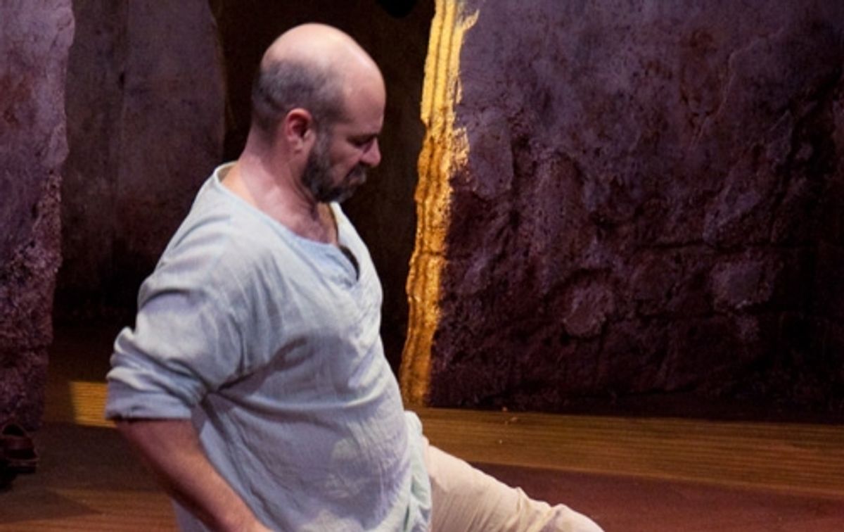 Yusef (Demosthenes Chrysan) is held in prison. at 