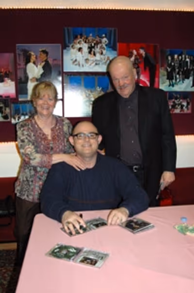 Long time friends Larry and Judi Budweiser after the show with Ronan Tynan Photo