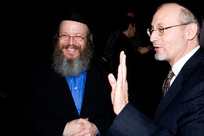 Yisrael Campbell with Mohel Rabbi Yehoshua Krohn  Photo