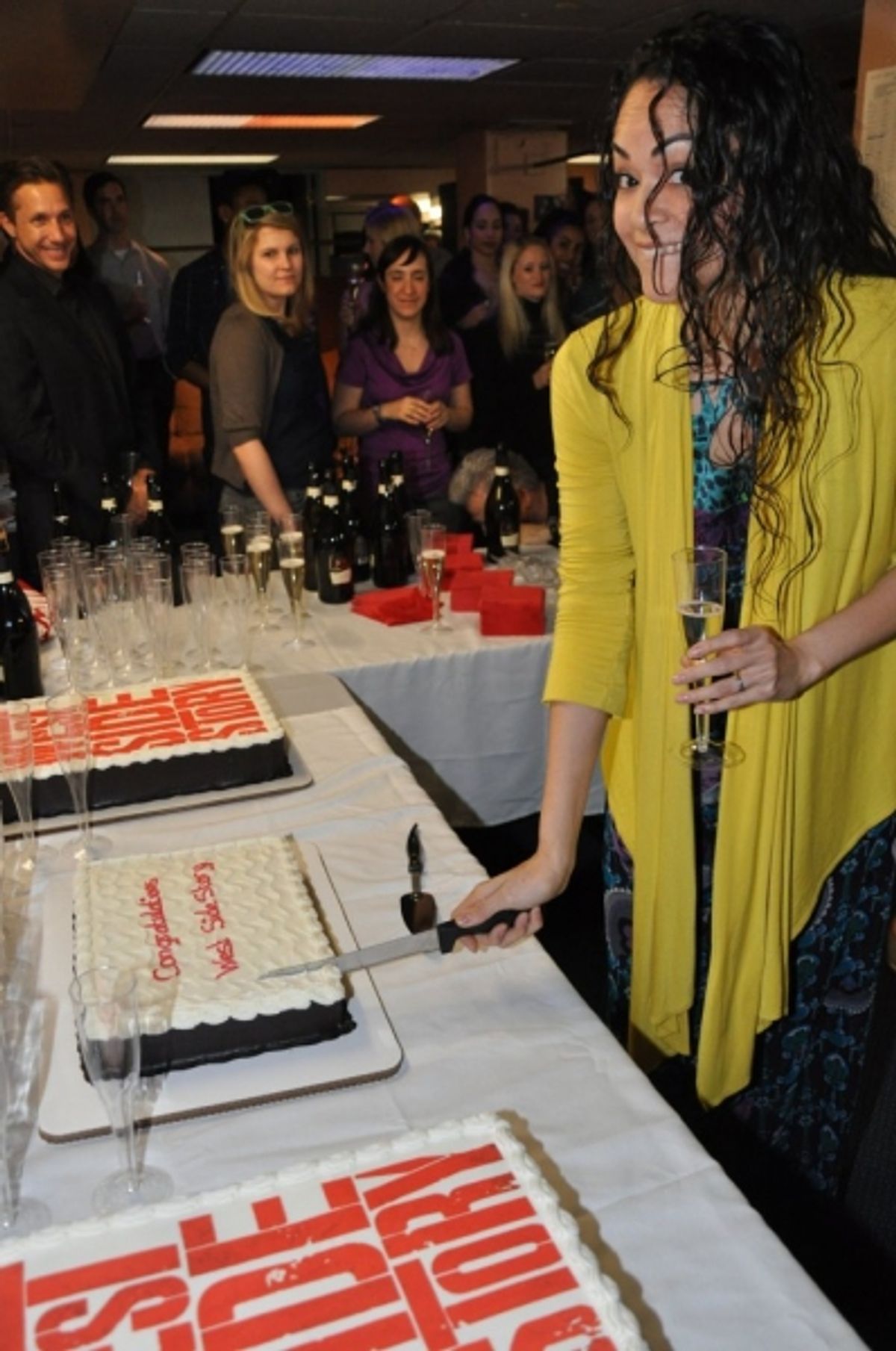 Karen Olivo cutting the first slice at 