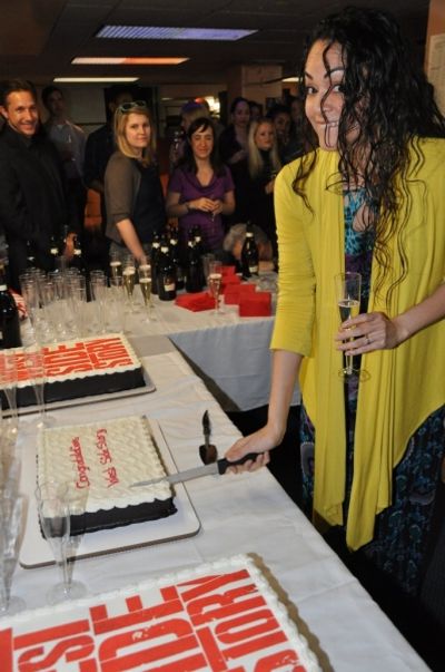 Karen Olivo cutting the first slice Photo