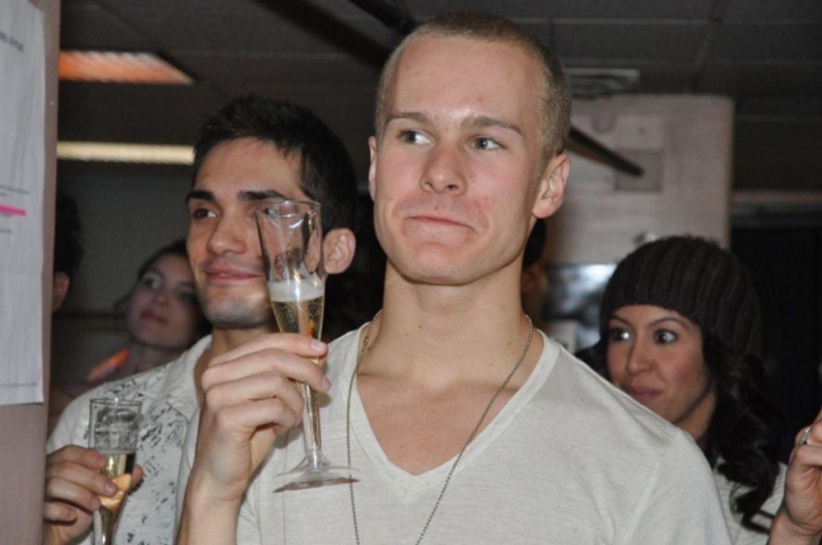 Ryan Steele raises his champagne  at 