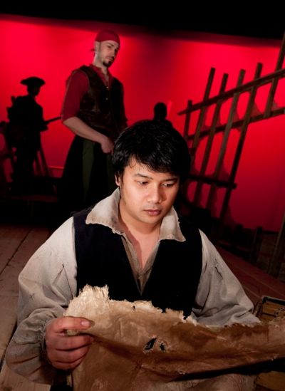  Kroydell Galima as Jim Hawkins (foreground) and James Anthony Zoccoli as Long John S Photo
