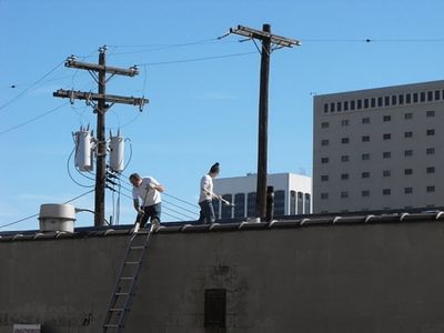  Brian Barlup, David Thonnings work to seal the roof leaks Photo