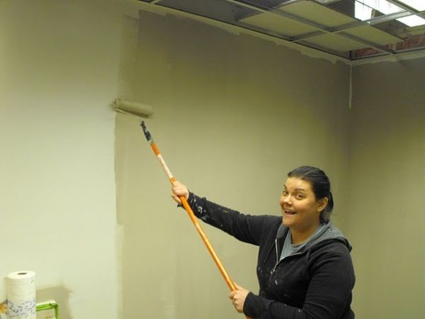 Amanda Bauer is happy to begin painting Photo