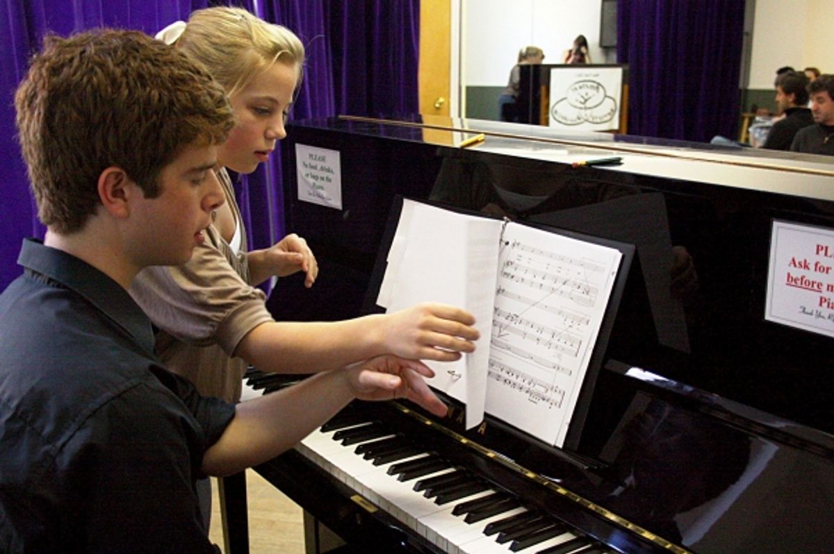 Adam Kaufman from '13' playing piano at 