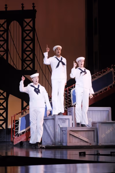 Newly-arrived sailors Ozzie (Greg McCormick Allen, left), Gabey (Joe Aaron Reid, cent Photo