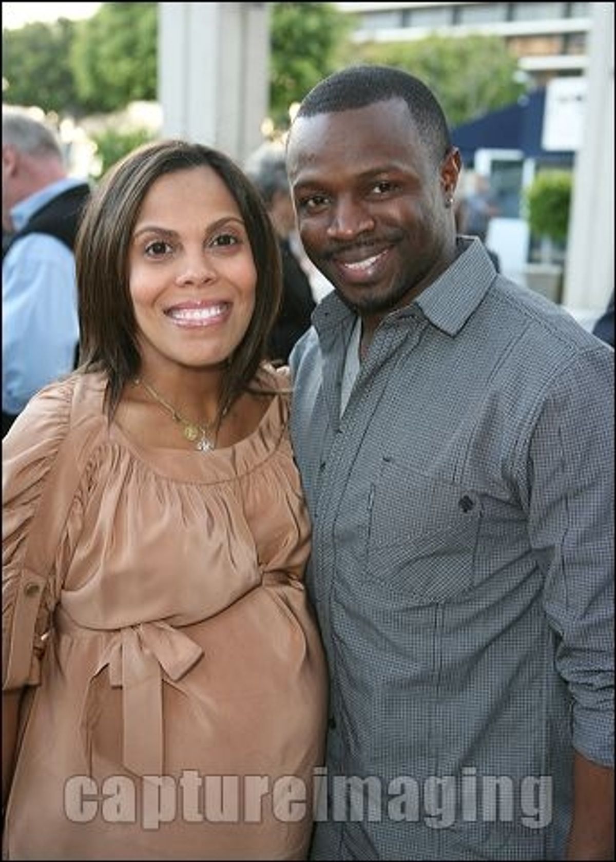 Sean Patrick Thomas (R) and pregnant wife Aonika Laurent Thomas 
 at 