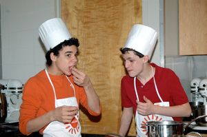 Trent Kowalik and David Alvarez sampling their cooking Photo