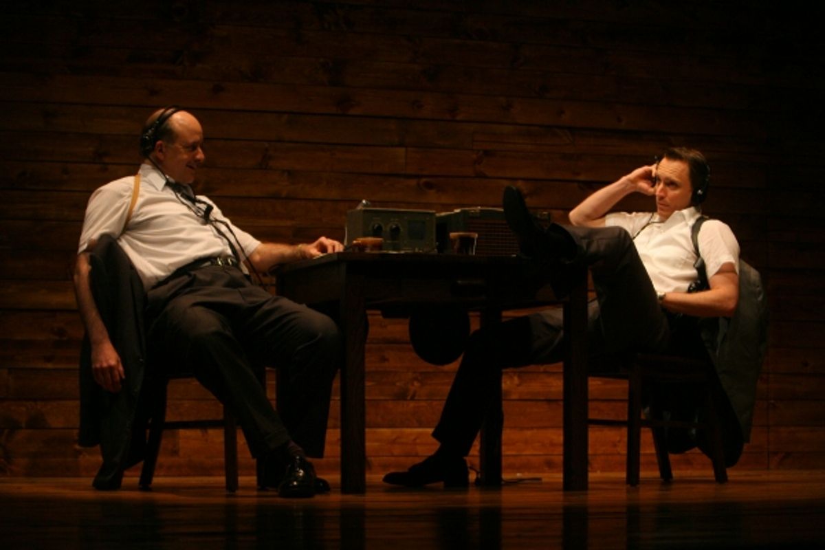 FBI agents Steve (Mick Weber) and Paul (John Hoogenakker) listen in to private conversations between the leaders of the movement at 