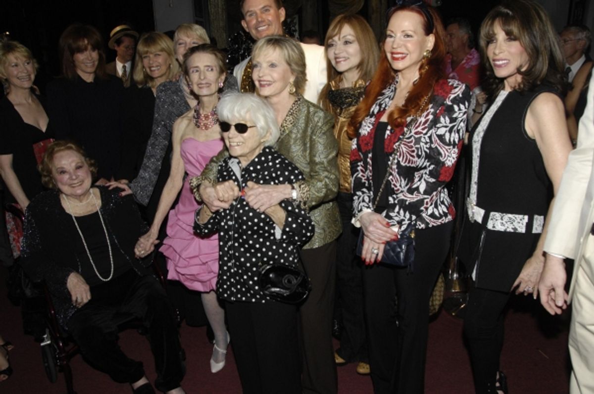 Designer Randy McLaughlin with Graffiti Gown Signatory Ladies: Lt - Rt - Dee Wallace, Rose Marie, Stefanie Powers, Ilene Graff, Alison Arngrim, Margaret O'Brien, Edith Shain, Florence Henderson, Judy Tenuta, Brenda Dickson and Kate Linder at 