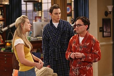 Penny (Kaley Cuoco, left) is surprised when she finds Leonard (Johnny Galecki, right) Photo