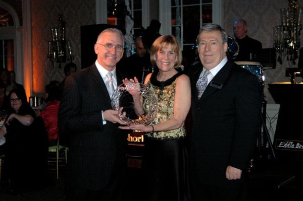 Mark S. Hoebee, Cynthia Mace and Mark W. Jones with the Frank Carrington Excellence i Photo