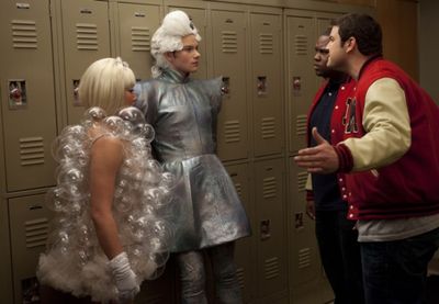 Tina (Jenna Ushkowitz, L) and Kurt (Chris Colfer, second from L) are approached by Ka Photo