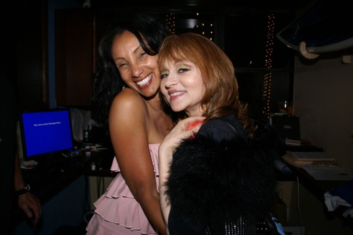 A fan interacts with Judy Tenuta at 