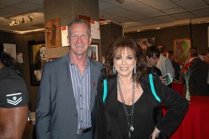 APLA Executive Director Craig E. Thompson with author Jackie Collins Photo