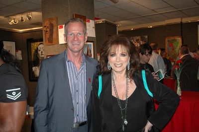 APLA Executive Director Craig E. Thompson with author Jackie Collins Photo
