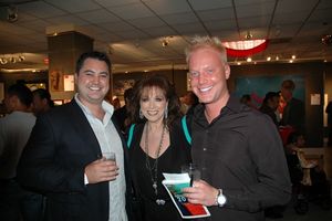 Jackie Collins poses with Art Project Los Angeles VIP guests. Photo