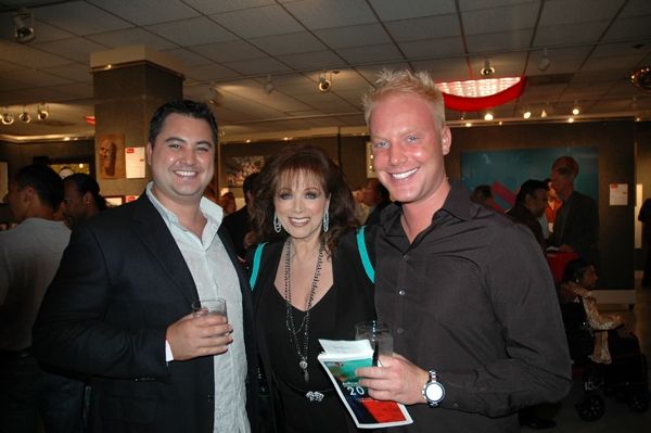 Jackie Collins poses with Art Project Los Angeles VIP guests. Photo