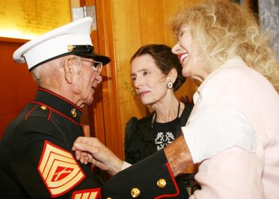 Harold "Skip" Adams (Gunnery Sargent USMC retired) is thanked by Margaret O'Brien and Photo