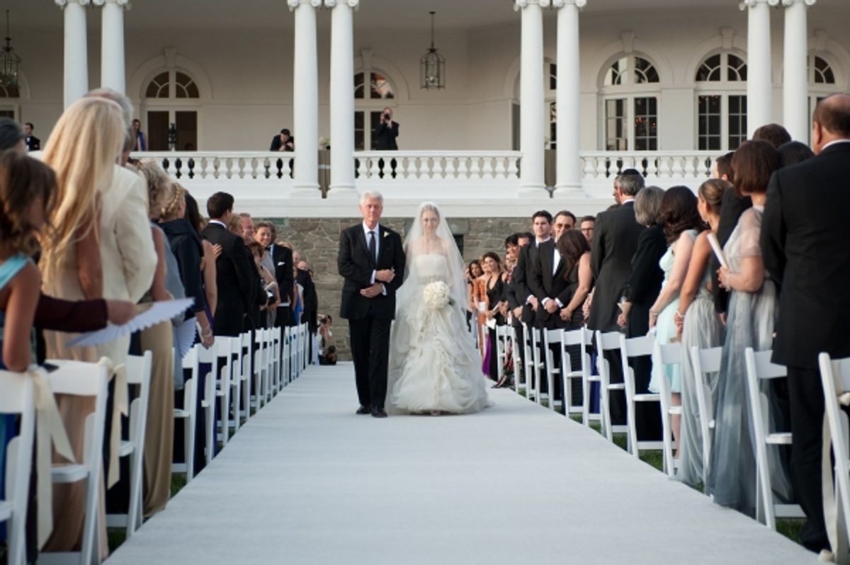 Bill Clinton (L) walks Chelsea Clinton down the aisle at Chelsea Clinton Marries Marc Mezvinsky