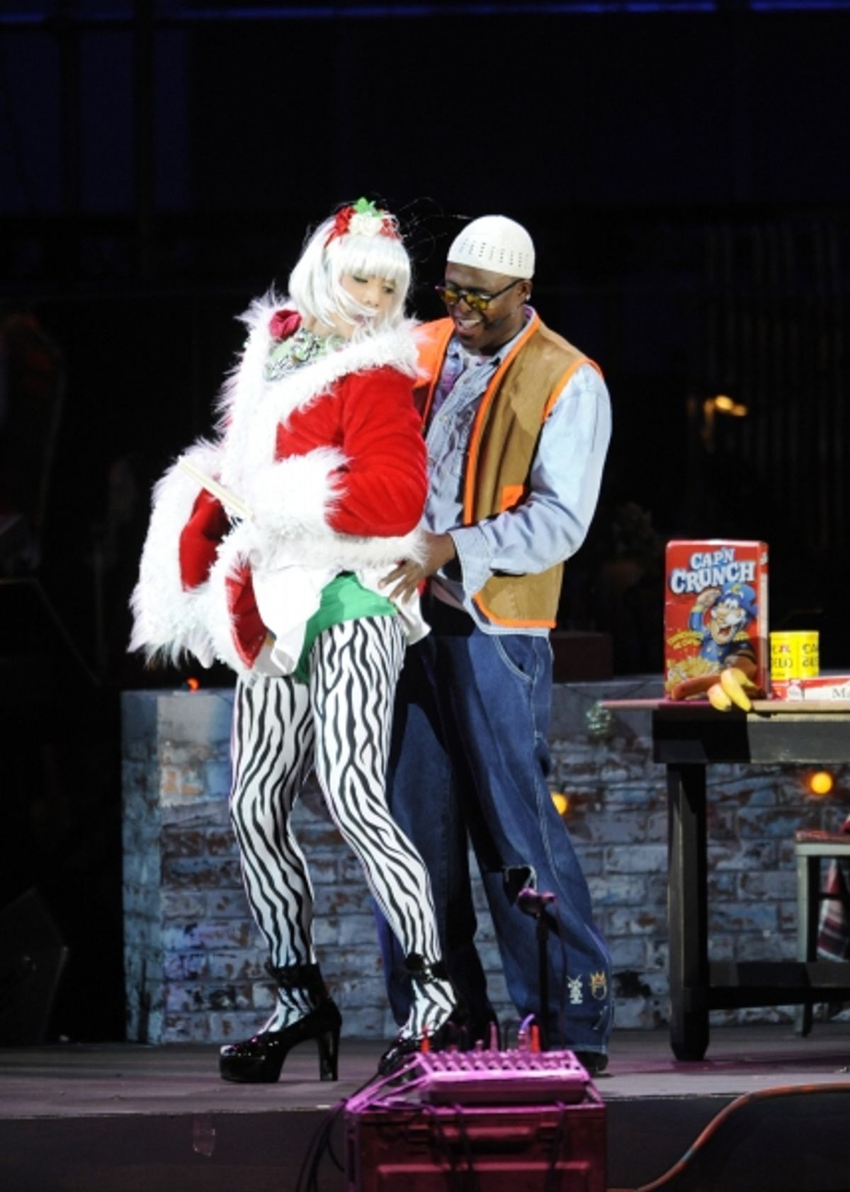 Telly Leung as Angel and Wayne Brady as Tom Collins at 