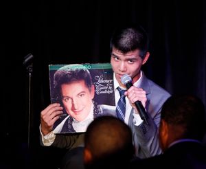 Telly Leung holds Liberace album Photo