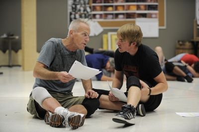 Larry Yando (Pangloss) tries to teach Geoff Packard Photo