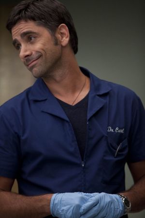 John Stamos guest-stars as Dr. Carl Photo