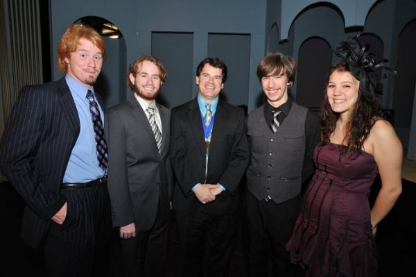 First Night honoree Paul Gatrell (center), with Luke Hatmaker, Zack McCann, Ben Stoni Photo