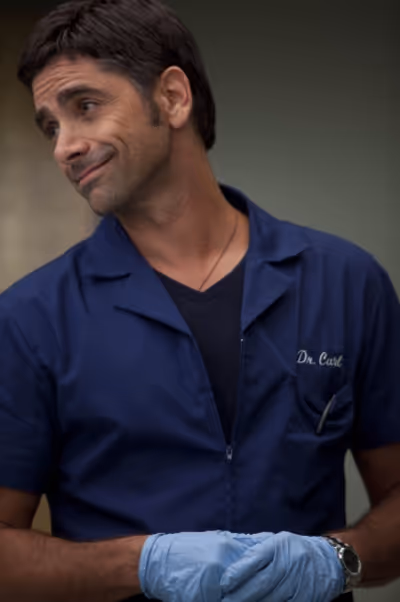 John Stamos guest-stars as Dr. Carl Photo