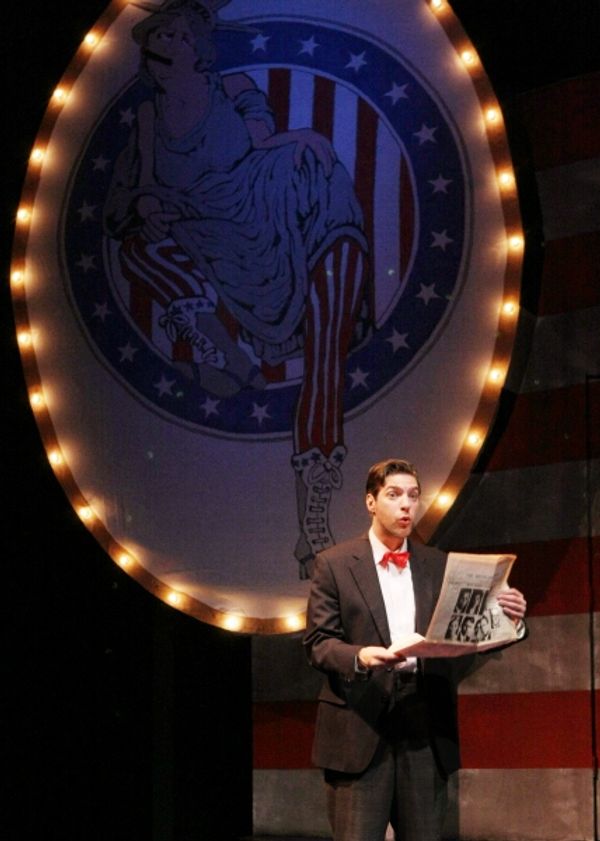 Dudley (Joseph Scrimshaw) creates some instant theater using the day's headlines Photo