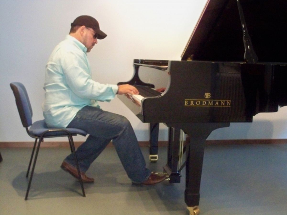 Frank Wildhorn practicing on a Brodman piano at 