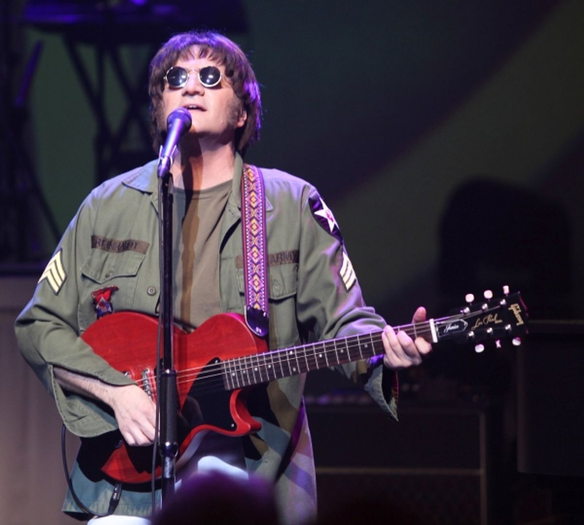 Steve Landes as John Lennon  at 