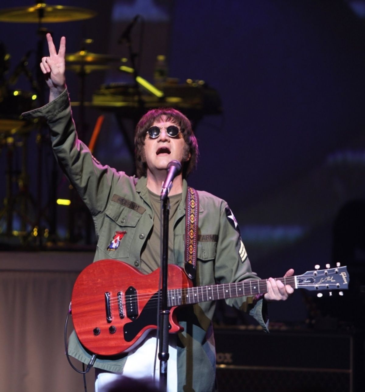 Steve Landes as John Lennon  at 